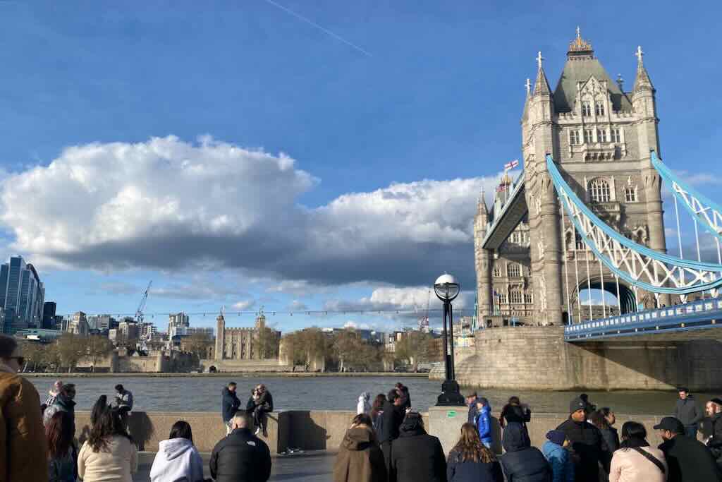 Tower bridge on the right side and Tower of London across the river Thames